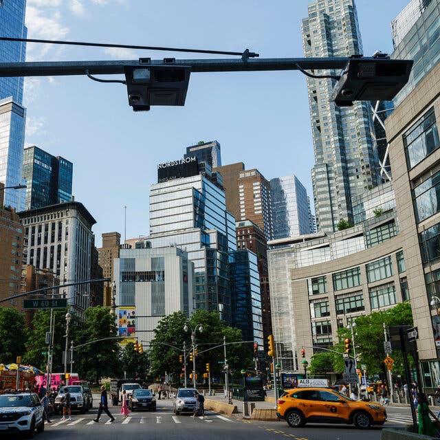 Electronic toll scanners hang over Broadway near Columbus Circle in Manhattan.